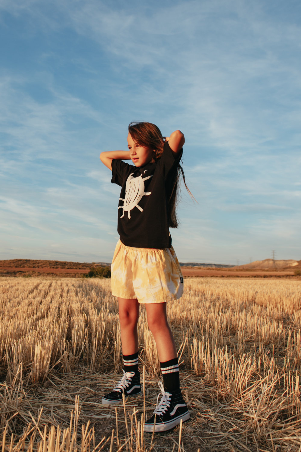 black unisex tee striking tie dye shorts