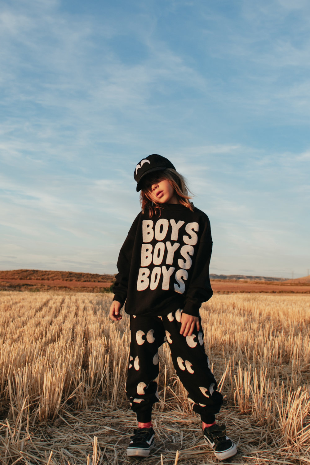 iconic black sweater elegant black pants in vogue unisex cap
