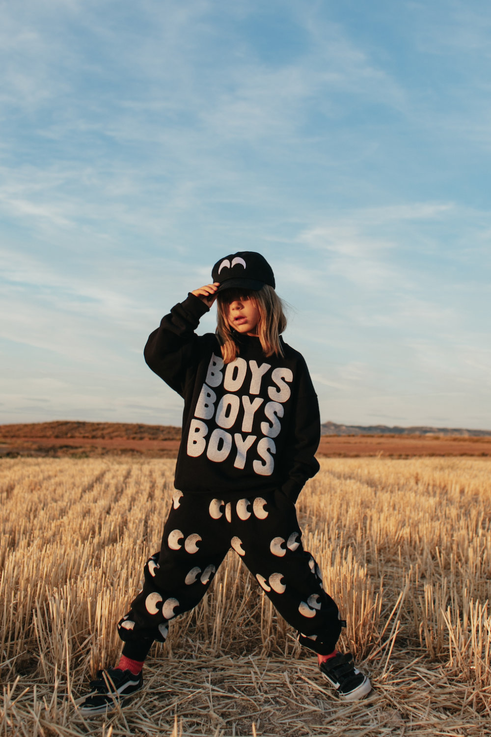 iconic black sweater elegant black pants in vogue unisex cap