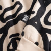 white organic sweater detail label